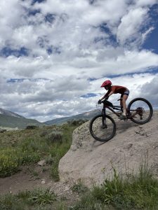A GO Girl participant rolls down a rock slab in excellent form.